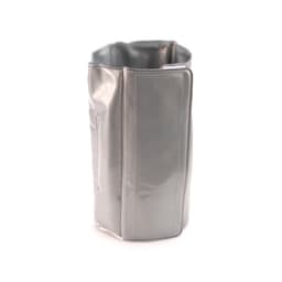 A drink bottle cooler in a sleek silver finish, featuring a glossy texture and a simple design.