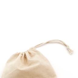 A beige drawstring bag with a textured surface and a natural rope closure. It includes a small logo.
