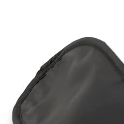 A black travel eye mask with a smooth finish and soft edges. Features stitching detail along the perimeter.