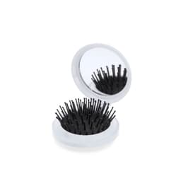 A compact hairbrush with black bristles and a circular mirror, featuring a white outer casing.