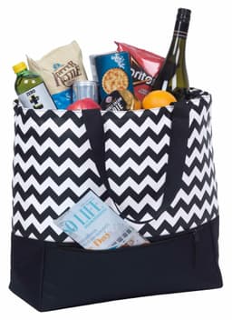 A black and white chevron tote bag filled with snacks, drinks, and a bottle, featuring a solid black base and shoulder straps.