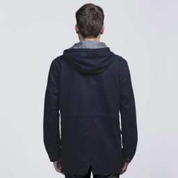 A navy blue twill jacket with a grey hood, featuring a logo. View from the back with a relaxed fit.