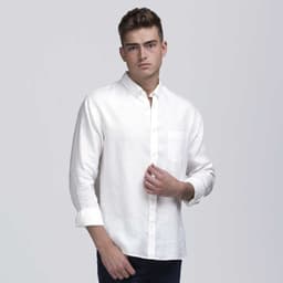 A light-coloured linen button-up shirt with long sleeves and a chest pocket. The model is posing against a plain background.