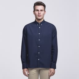 A navy button-up shirt with a collar, featuring a front pocket and a logo on the chest.