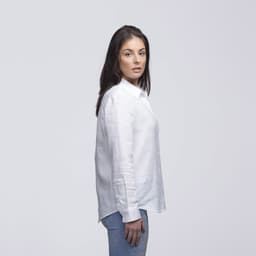 A white linen button-up shirt displayed on a model, featuring a relaxed fit and long sleeves.