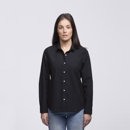 A woman is wearing a black button-up shirt with long sleeves and a collar. The shirt features a logo.
