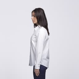 A white button-up shirt displayed on a model from the side, featuring a logo on the fabric.