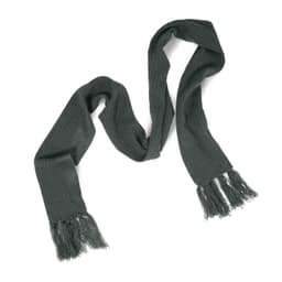 A Nebraska Cable Knit Scarf in a dark green color with frayed edges.