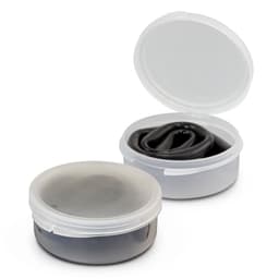 A black silicone straw folded inside a clear plastic case, with the case partially open.