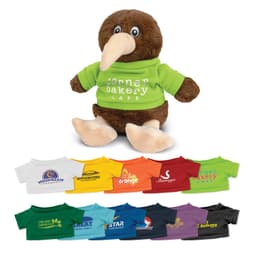 A plush kiwi toy with brown fur, wearing a green shirt, sits above a variety of colourful miniature shirts.