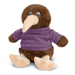 A brown kiwi plush toy wearing a purple shirt, featuring large eyes and soft pink feet. It has a branding logo.