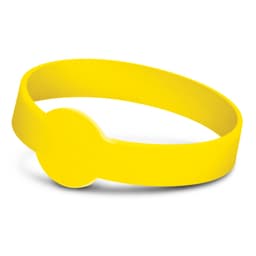 A yellow silicone wristband with a debossed design, featuring a circular emblem at the centre.