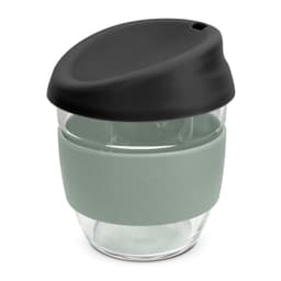 A drink bottle featuring a clear borosilicate body with a black lid and a soft green silicone sleeve.