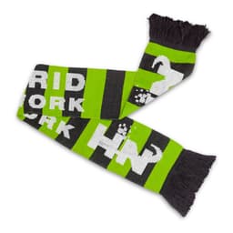 A green and black knitted scarf with a fringe, featuring a patterned design and a logo.