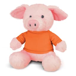 A pink plush pig toy wearing an orange shirt, featuring soft, rounded ears and a cute facial expression.