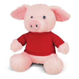 A pink pig plush toy wearing a red shirt, featuring large ears and a soft, cuddly design. It has small black eyes and a round snout.