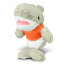 A grey and white shark plush toy wearing an orange shirt, featuring a big smiling mouth and soft, cuddly texture.