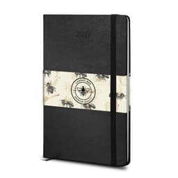 A black Moleskine 2027 planner with a decorative band featuring bees, designed for weekly planning.