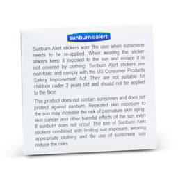 A pack of Sunburn Alert Stickers in a white box. It has a logo and provides information about sun protection.