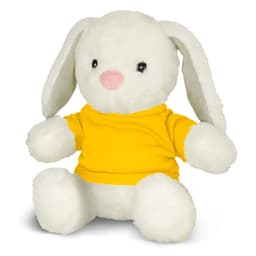 A white rabbit plush toy wearing a yellow shirt, sitting with a soft expression and floppy ears.
