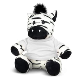 A plush zebra toy in black and white, featuring a white shirt and a tuft of black fur on its head.