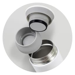 A drink bottle in white with a detachable grey lid, showcasing the interior opening and the lid's seal.
