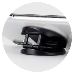 A black phone holder with a sturdy base, designed to support a smartphone.