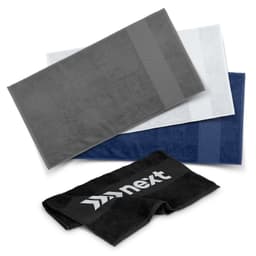A set of three gym towels in grey, white, and navy, with a towel featuring a logo on the front.