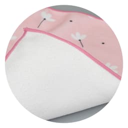 A medium blanket featuring a pink floral design on one side and a soft white underside. It has a contrasting pink trim.