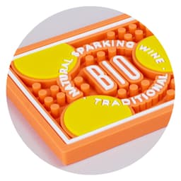 A PVC bar runner featuring orange and yellow colours with circular pads and a textured surface. It has a logo.