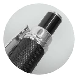 A metal Guilloche pen in black, featuring a textured grip and a silver accent. The pen has a sleek design and a logo.