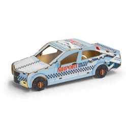 A wooden model of a sedan car in blue and white, featuring a checkered design and a branded logo.