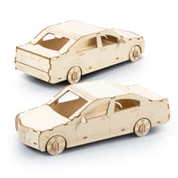 A wooden model of a sedan car in a natural wood finish, featuring detailed wheels and windows.