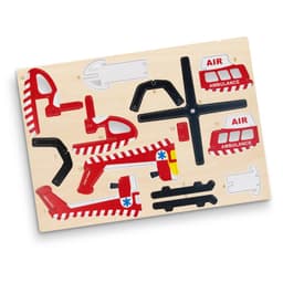 A wooden puzzle featuring red and black helicopter and ambulance shapes, set against a light wooden background.