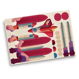 A wooden model kit of a rocket ship, featuring various pieces in red, blue, and cream, with a logo present.