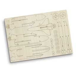 A wooden model kit featuring rocket ship components with various shapes, set on a light-coloured wooden sheet.