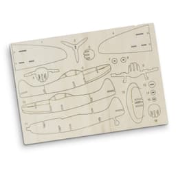 A wooden model kit of the Spitfire aircraft featuring various pre-cut parts in light beige. Includes a logo.