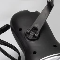 A black Dynamo Solar Torch featuring a foldable handle and a lanyard attachment.