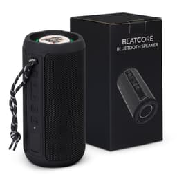 A black Bluetooth speaker with a textured surface, accompanied by a branded box featuring various buttons and a carrying strap.