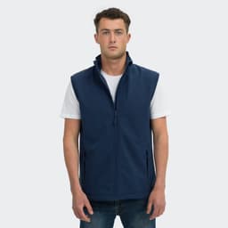 A navy blue men's vest with a zip front, standing model, featuring side pockets and a collar, with a logo.