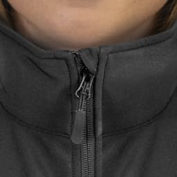 A close-up of a black women's vest with a zip featuring a high collar. Logo visible on the vest.
