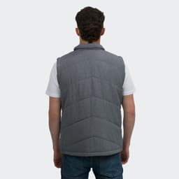 A grey mens puffer vest with a chevron pattern, featuring a collar and a branding logo on the back.
