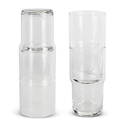 A stackable glass tumbler set in clear glass, featuring four tumblers and a larger glass.