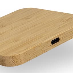 A bamboo wireless charging hub with a sleek, rounded design and a USB-C port.
