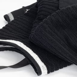 A black terry golf towel with ribbed texture, featuring white detailing and a loop for hanging.