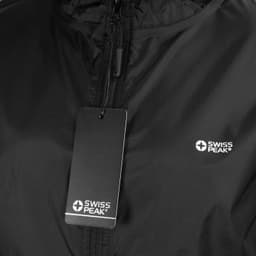 A black windbreaker jacket featuring a zip front and a logo. It includes a tag attached to the zipper.