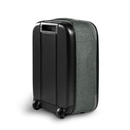 A small wheeled suitcase featuring a black hard shell and grey fabric side. It includes a handle and wheels for transport.
