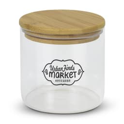 A large round glass storage canister with a bamboo lid and a decorative logo on the front.