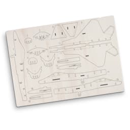 A wooden model kit featuring various parts for a jet fighter, displayed on a light-coloured wooden board.