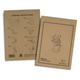 A brown cardboard box featuring assembly instructions and an illustration of a koala wooden model. It has branding on the front.